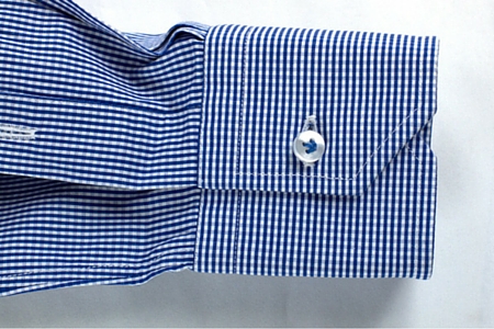 Mitered cuff of a tailor-made white men's blue checkered shirt