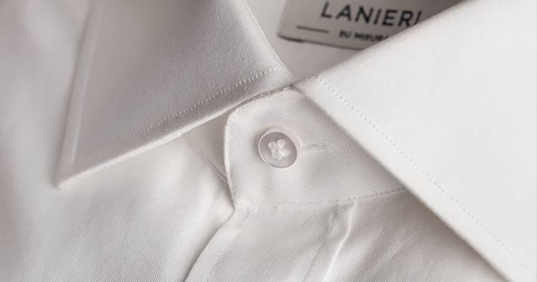 Close up on collar's button of a Lanieri's white shirt for men with cutaway collar