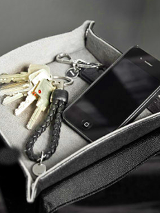i-phone and keys in a trinket tray