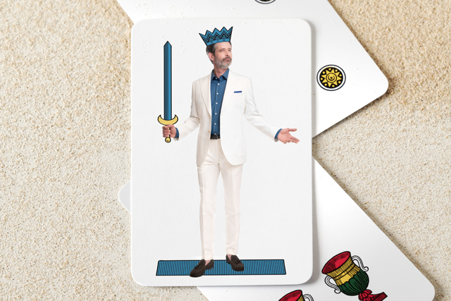 Italian neapolitan playing card: man in white suits dressed as king of swords