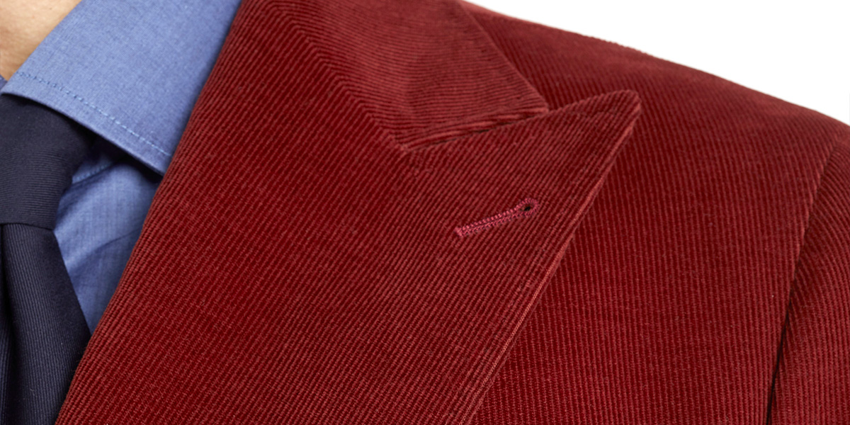 Wide pointed lapel on jacket in red velvet ribbed
