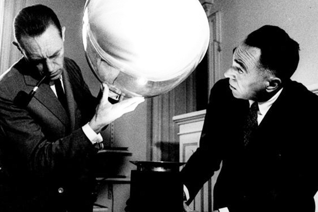 The brothers, Pier Giacomo and Achille Castiglioni with their lamp