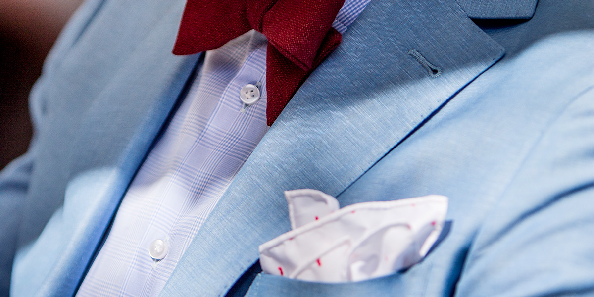 light-blue linen suit, combined with pocket square and customised bow tie